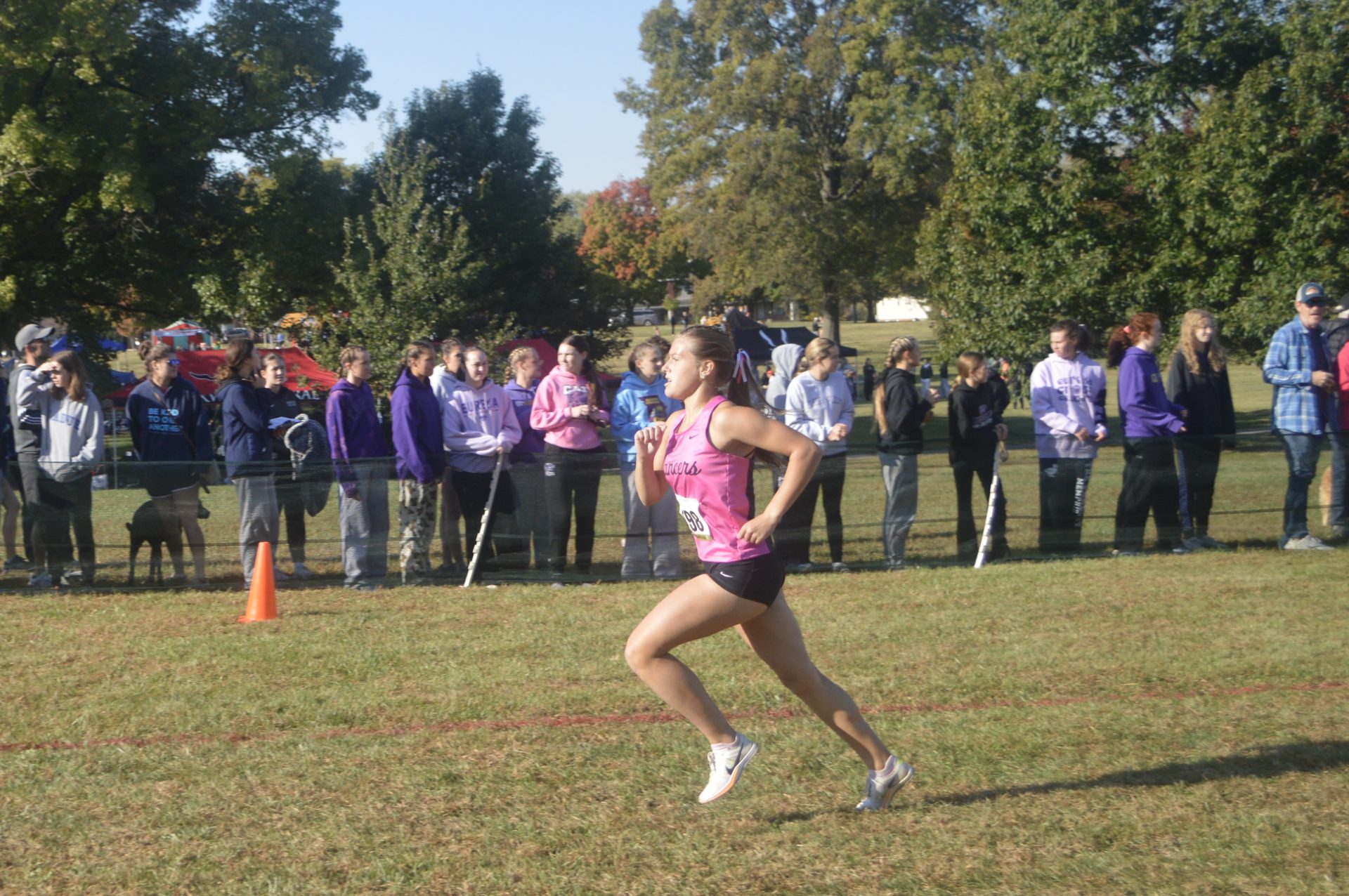 Kelly racing at XC Conference meet