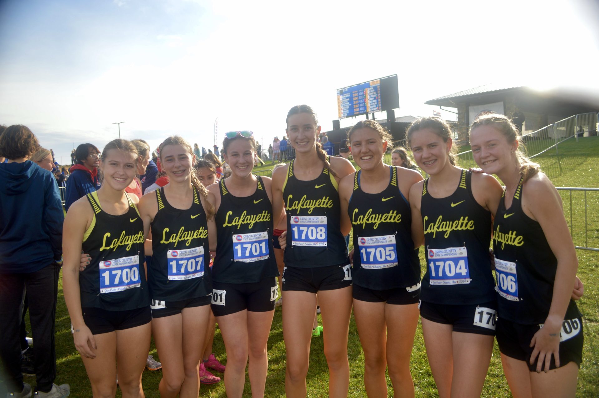 Kelly with cross country team at 2024 State
