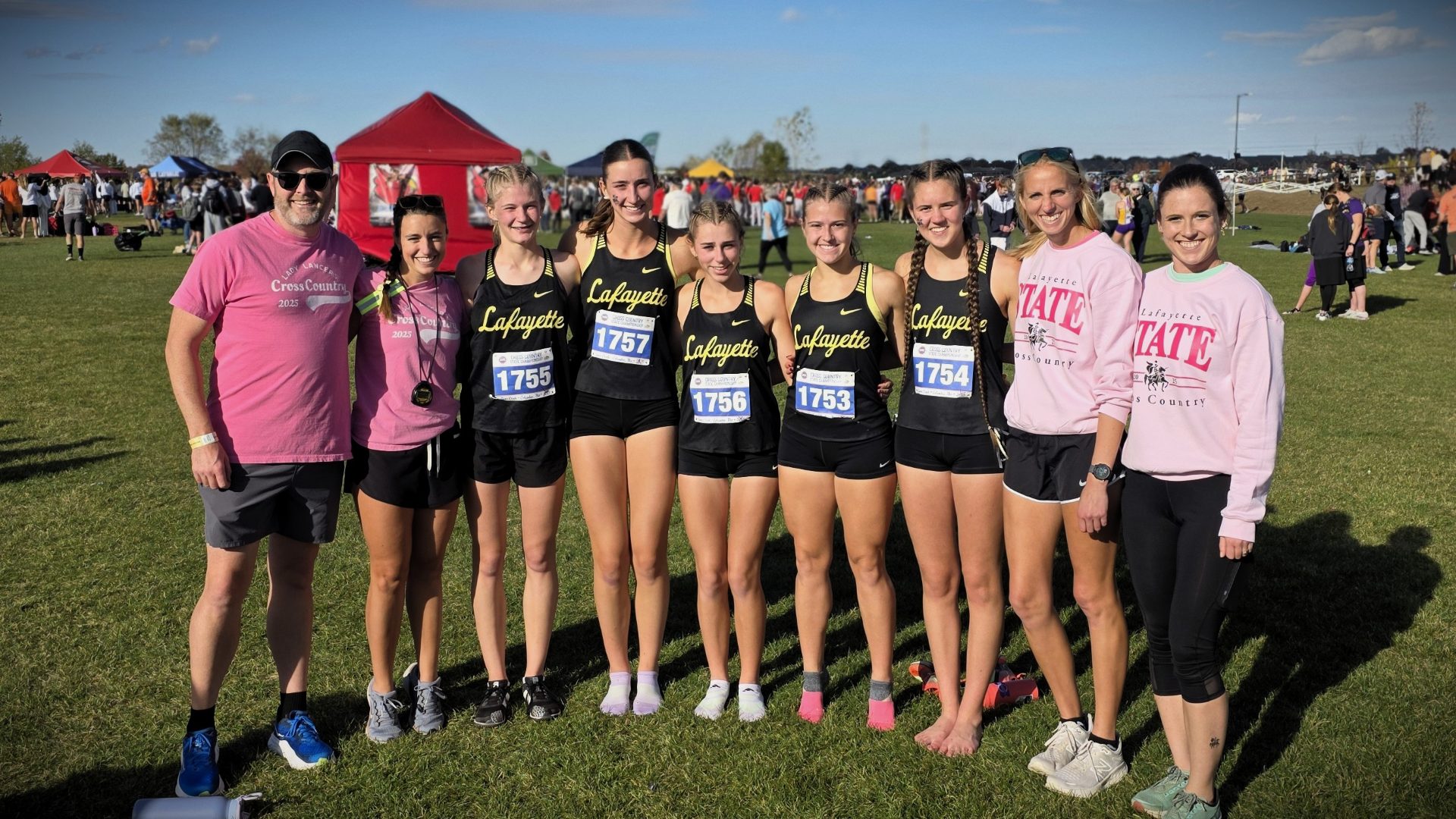 Kelly with cross country team at 2025 State