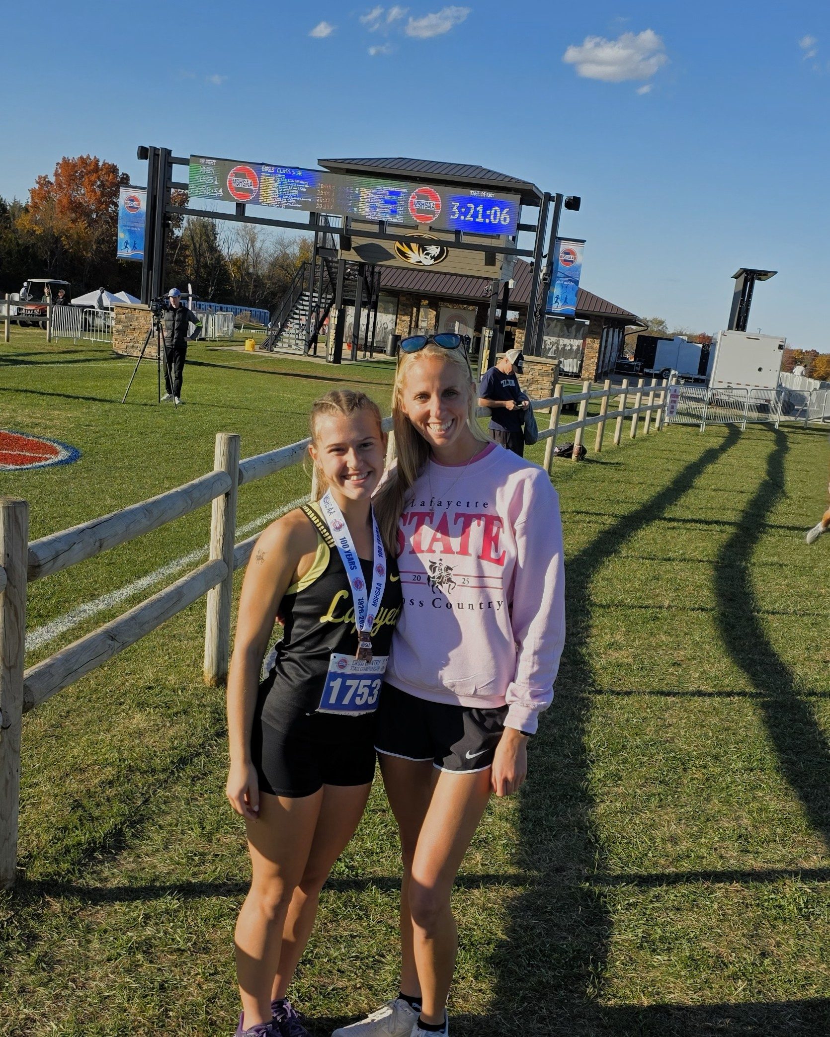 Kelly with Coach Harmon at State 2025