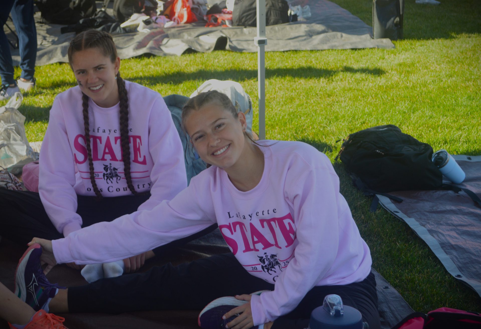 Kelly with cross country team at 2025 State